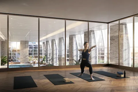 a living room with furniture and large windows