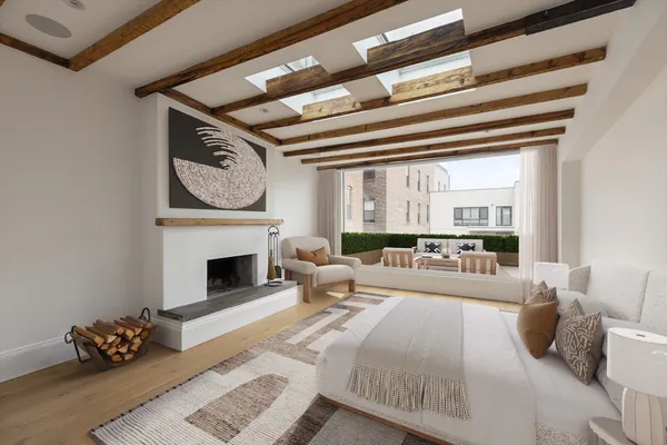 a spacious bedroom with a bed and a dresser