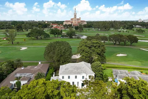 an aerial view of a house with a garden
