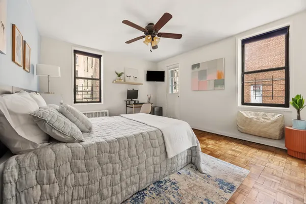 a bedroom with a bed and window