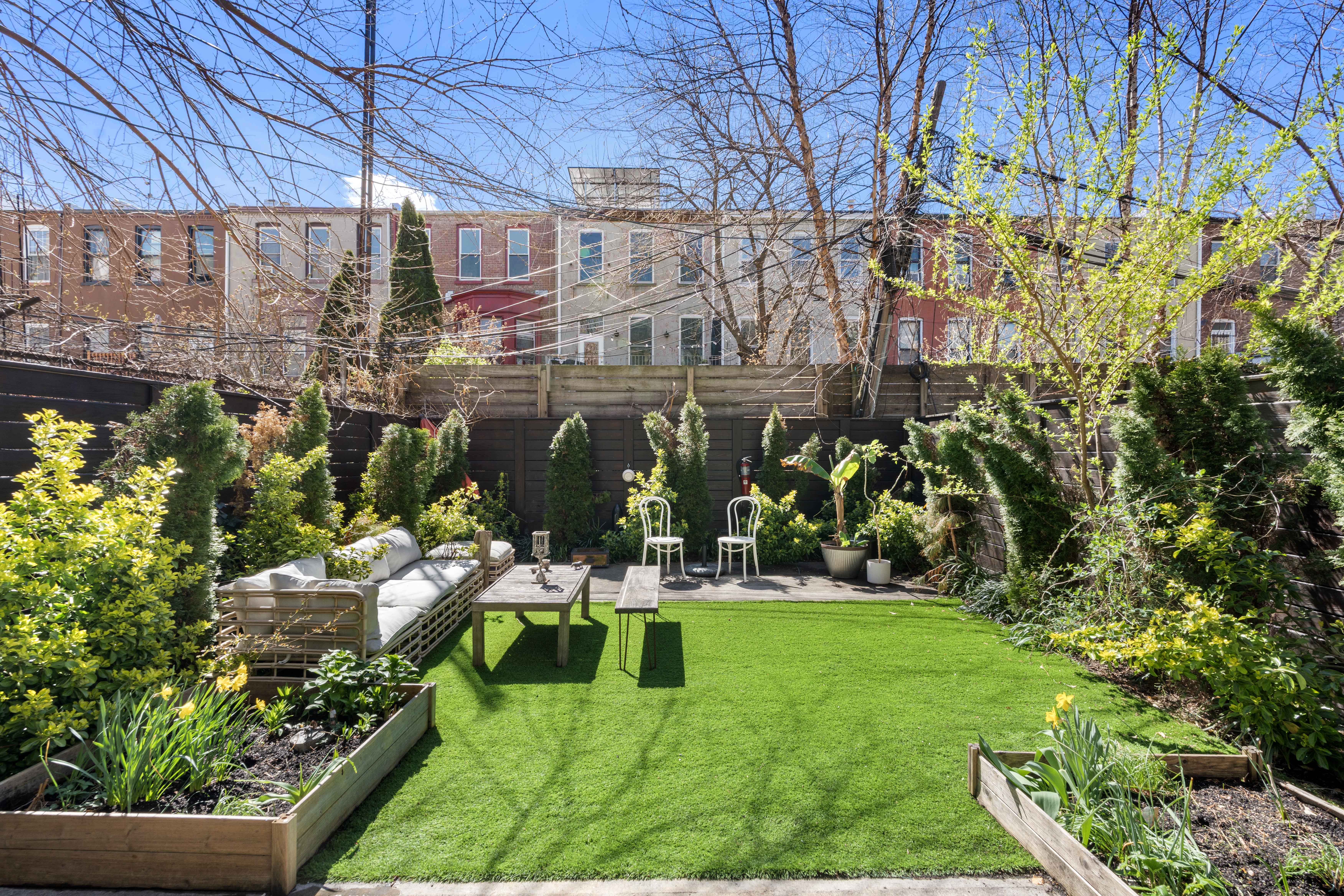 676 Halsey Street, Unit 1B Brooklyn, NY 11233 - Photo 1 of 9 a view of a chairs and table in backyard