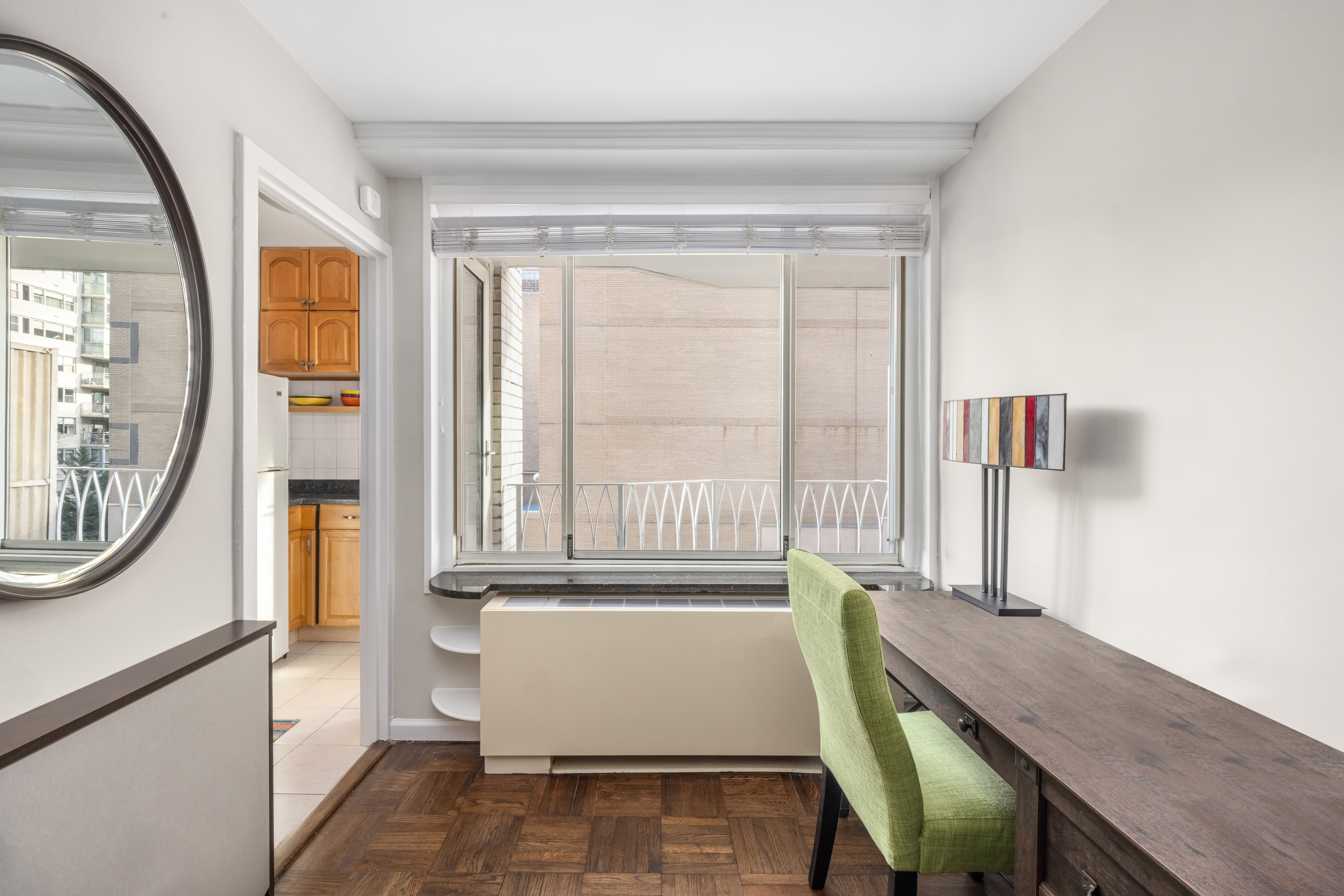 1160 3rd Avenue, Unit 6BC Manhattan, NY 10065 - Photo 4 of 13 a view of a room with wooden floor and windows