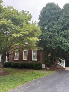 a front view of a house with yard
