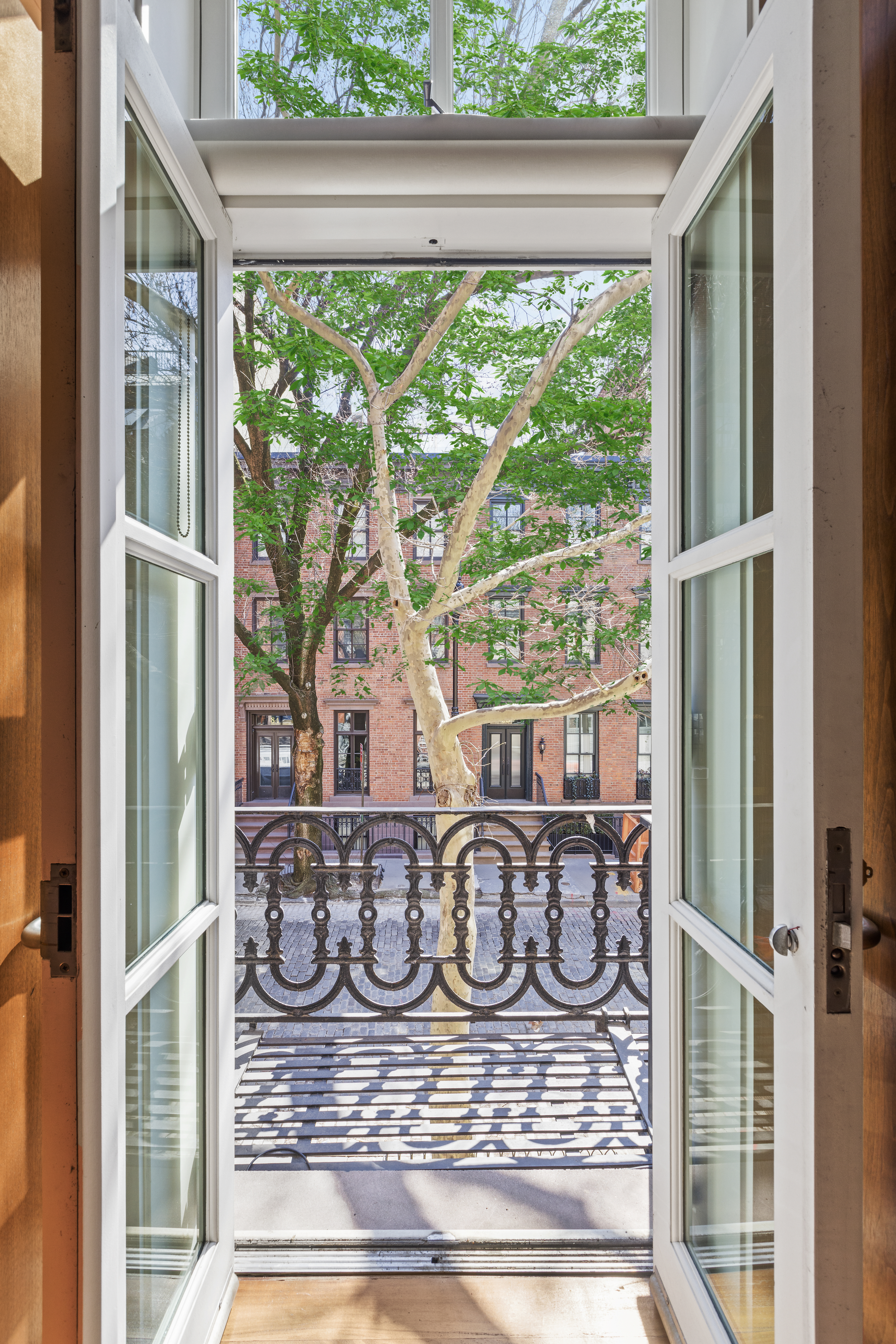 83 Jane Street, Unit TH1 Manhattan, NY 10014 - Photo 12 of 29 a front view of a house with porch
