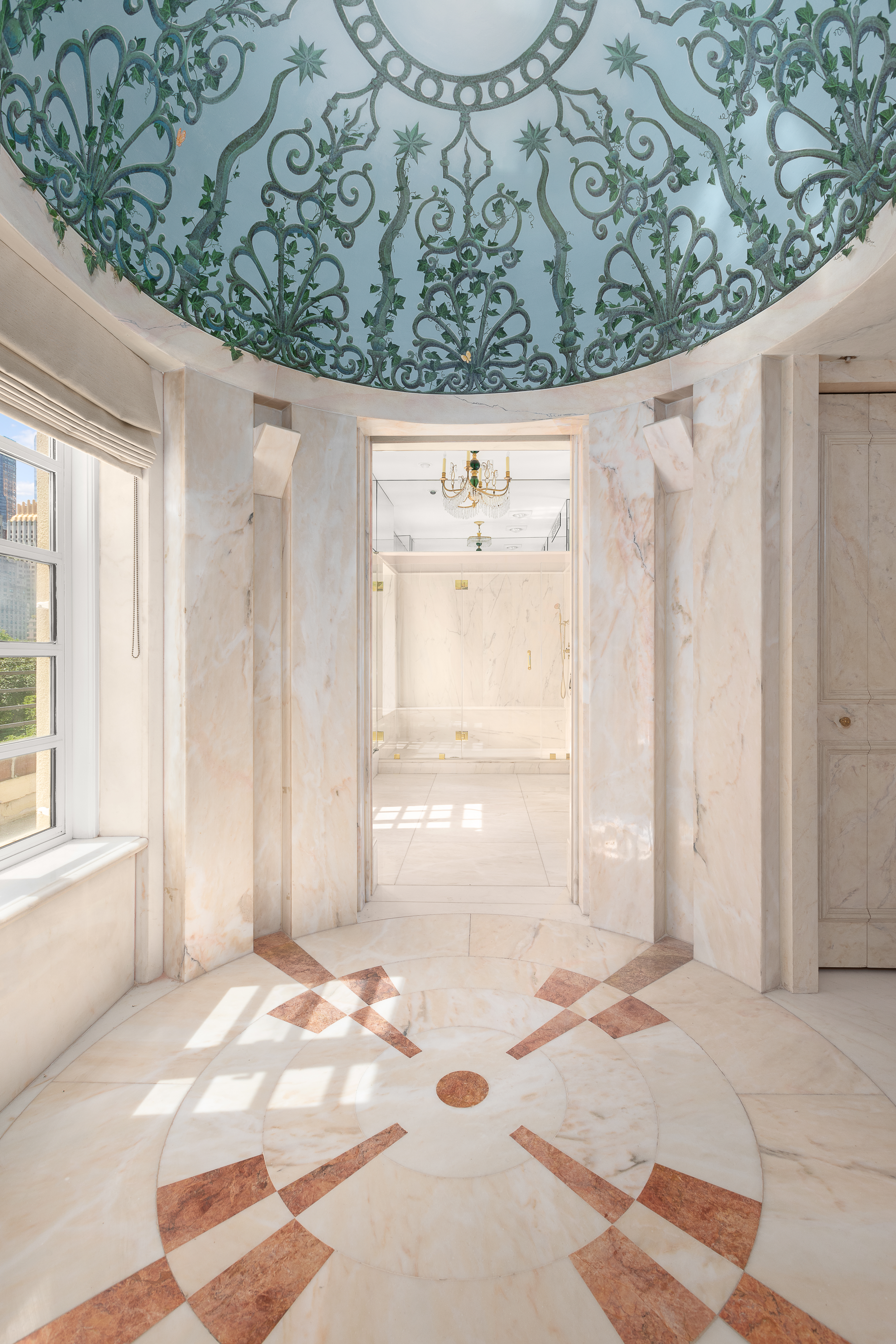 1 East 62nd Street, Unit PH Manhattan, NY 10065 - Photo 8 of 13 a view of a bedroom with a window and refrigerator