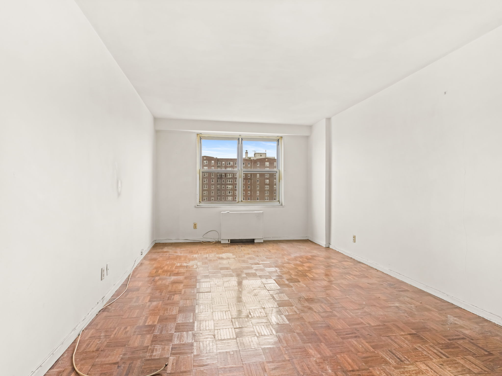 555 Kappock Street, Unit 11J Bronx, NY 10463 - Photo 14 of 24 an empty room with windows