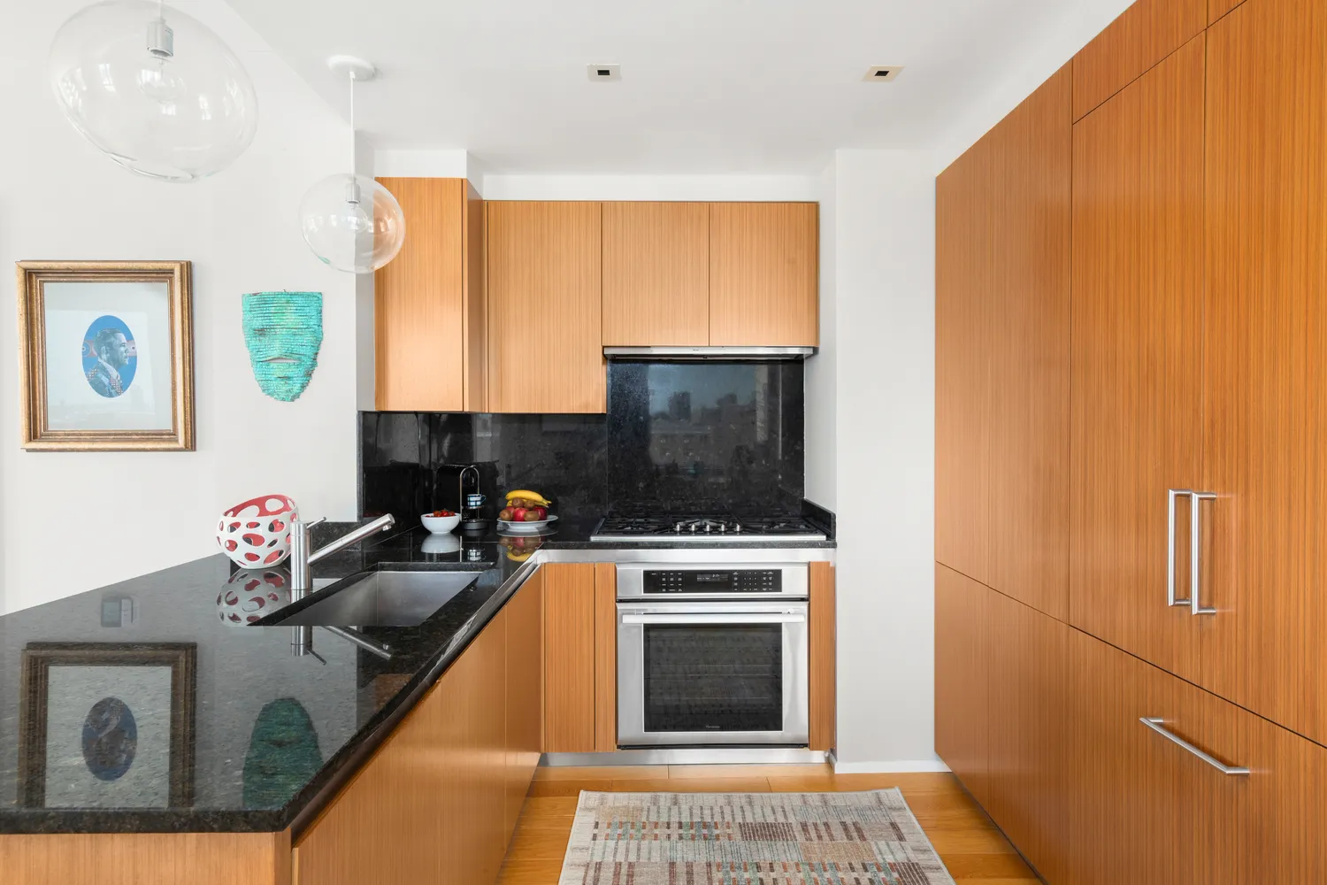 a kitchen with a stove a sink and a microwave