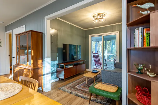 a dining room with furniture and window