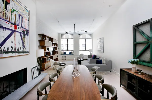 a very nice looking living room with furniture and a fireplace
