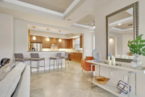 a lobby with furniture and a large mirror