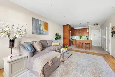 a living room with furniture and a table