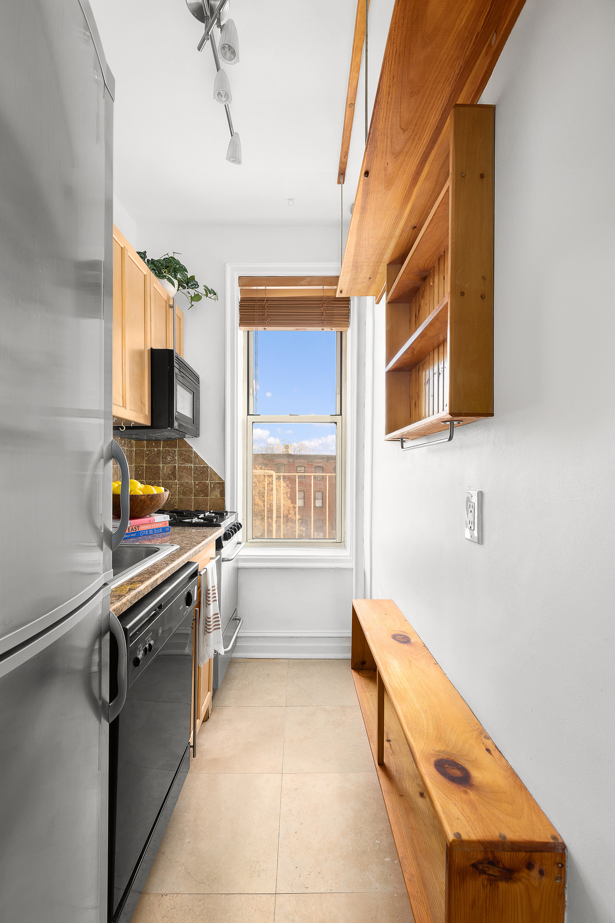 451 Clinton Avenue, Unit 3D Brooklyn, NY 11238 - Photo 5 of 8 a bathroom with a tub sink and mirror