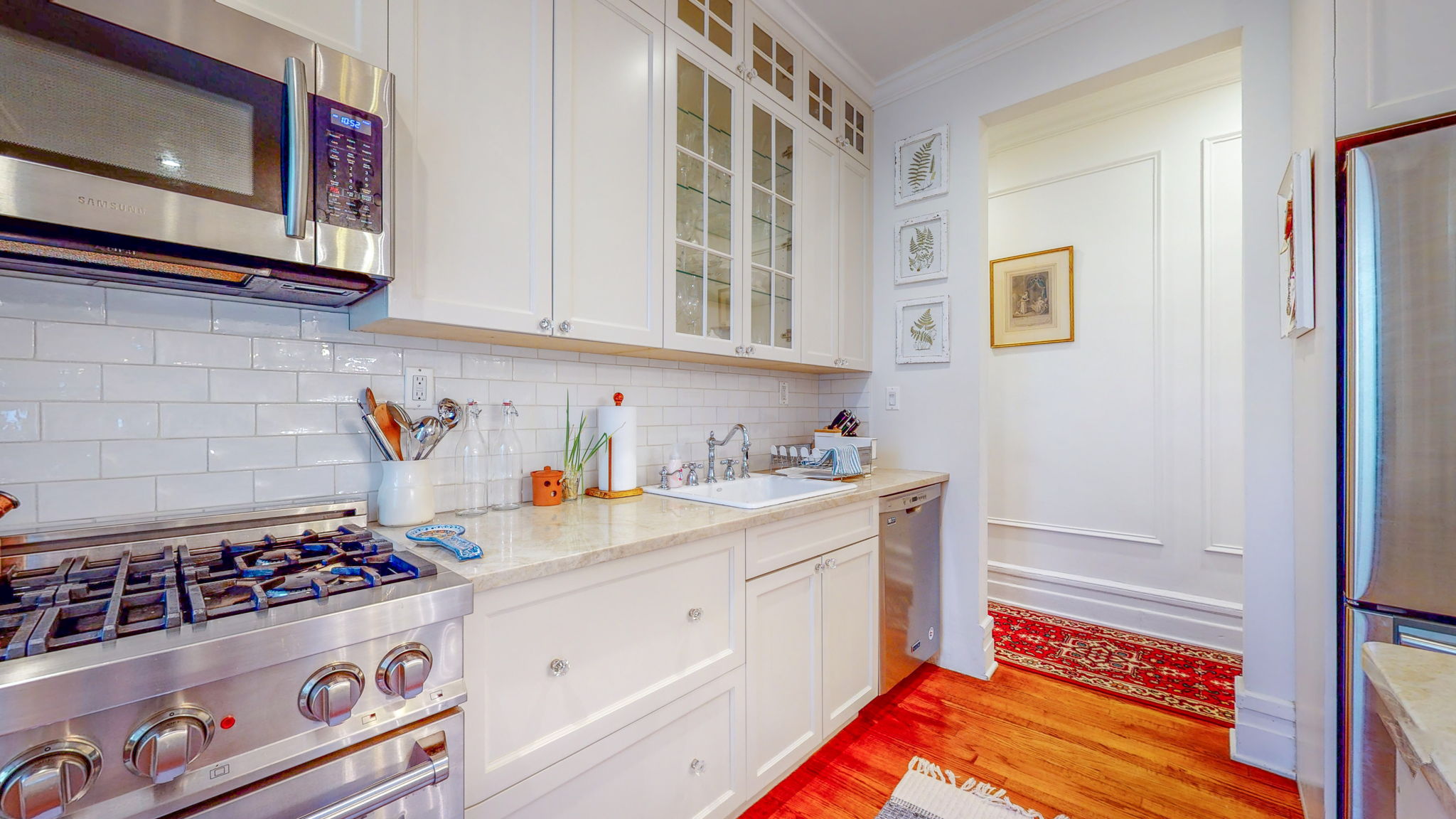 47 Fort Washington Avenue, Unit 55 Manhattan, NY 10032 - Photo 11 of 20 a kitchen with stainless steel appliances a stove a sink and a microwave