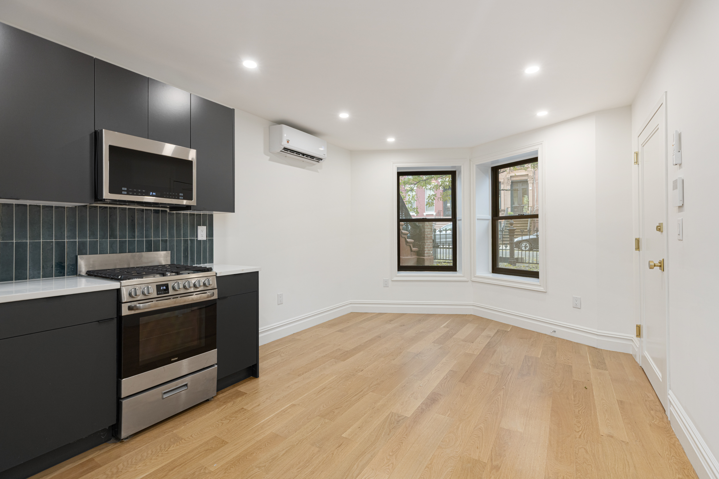15 Verona Place, Unit GARDEN Brooklyn, NY 11216 - Photo 2 of 14 a kitchen with a stove and a microwave