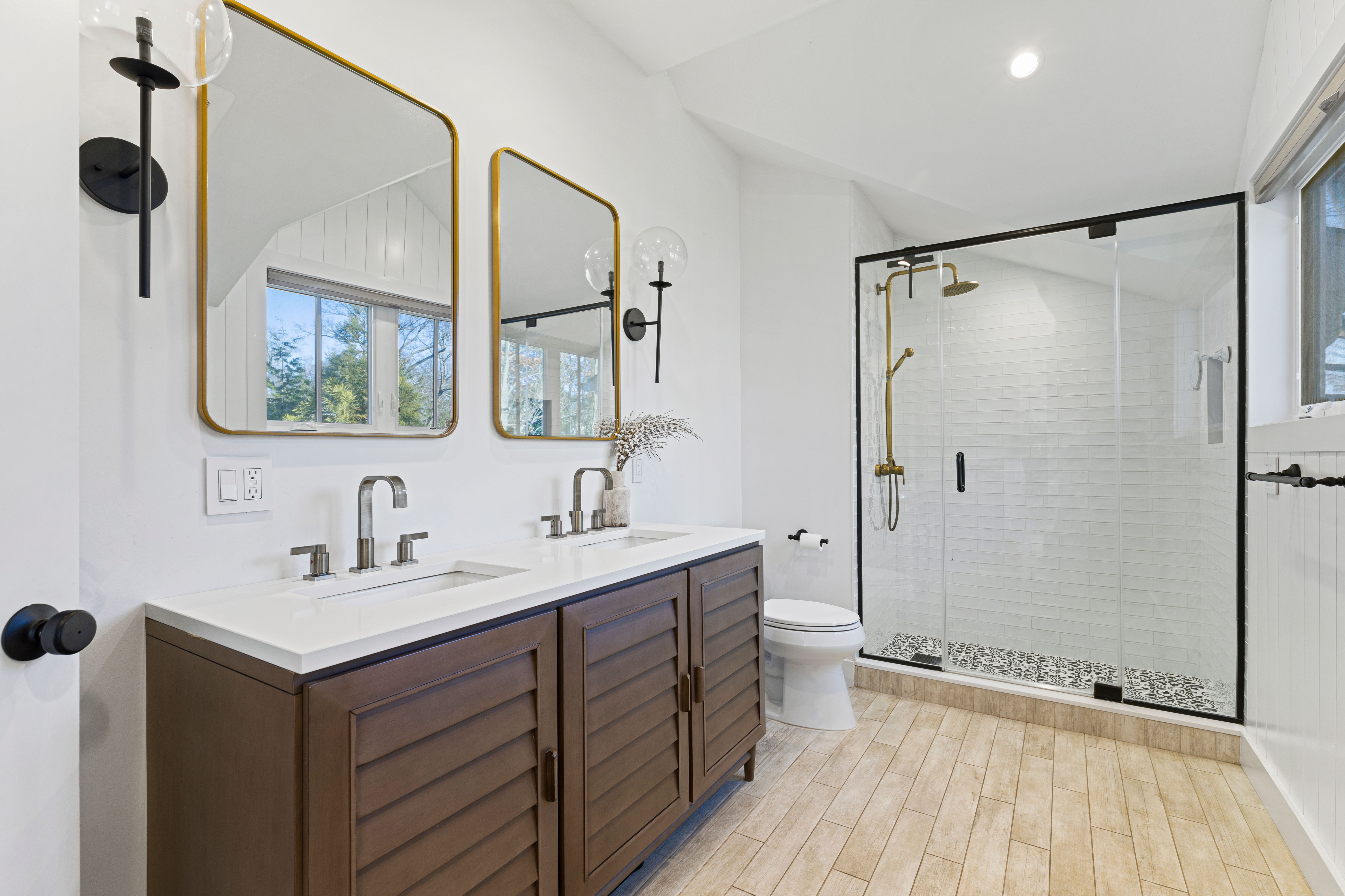 467 Midland Avenue Rye, NY 10580 - Photo 10 of 19 a bathroom with a double vanity sink mirror and shower