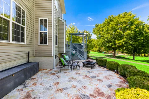 a view of a backyard with sitting area
