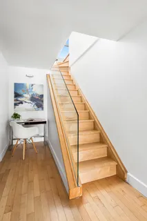 a view of a living room and wooden floor