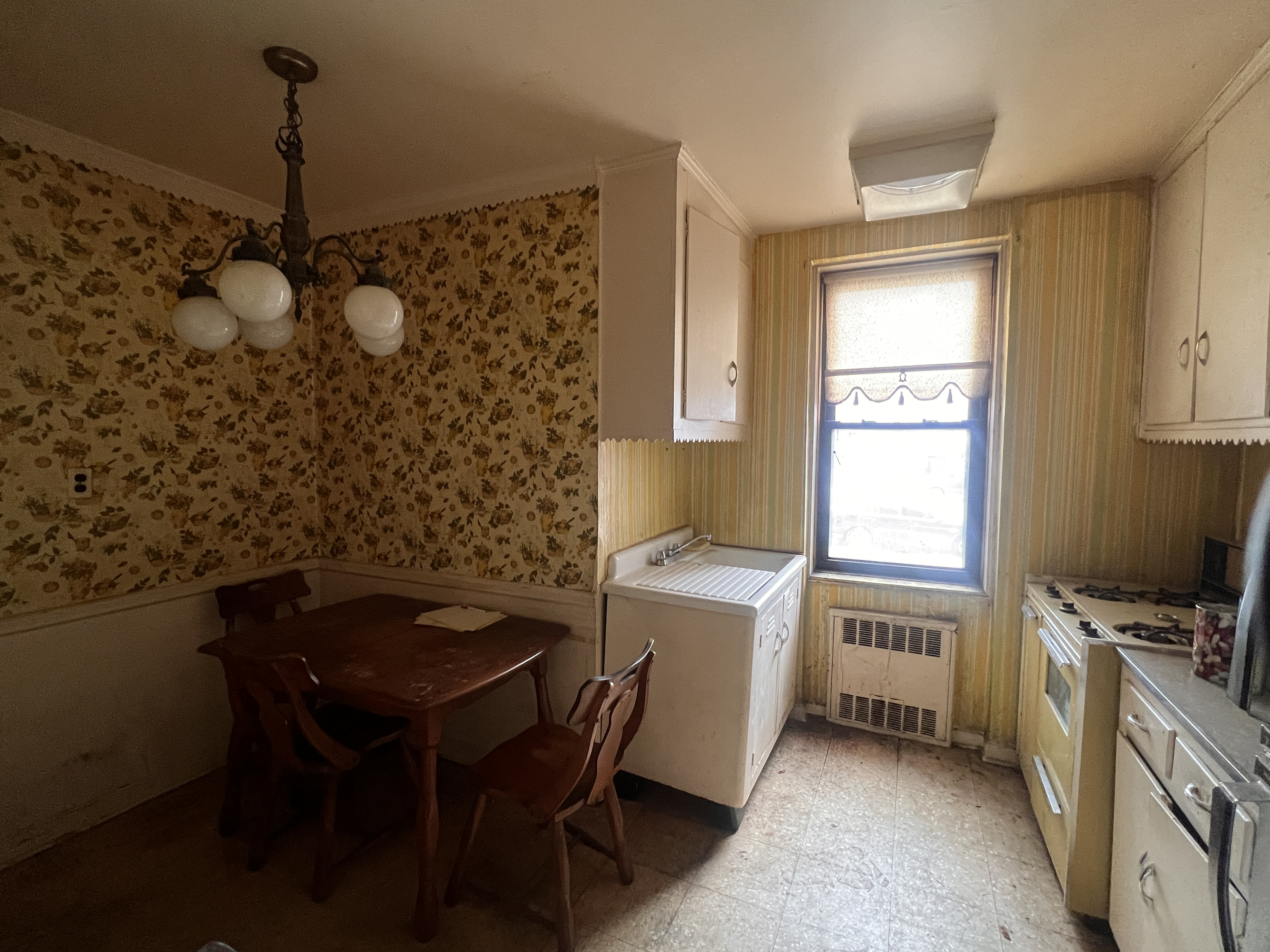 2251 Knapp Street, Unit 1C Brooklyn, NY 11229 - Photo 4 of 12 a kitchen that has a sink and a stove in it