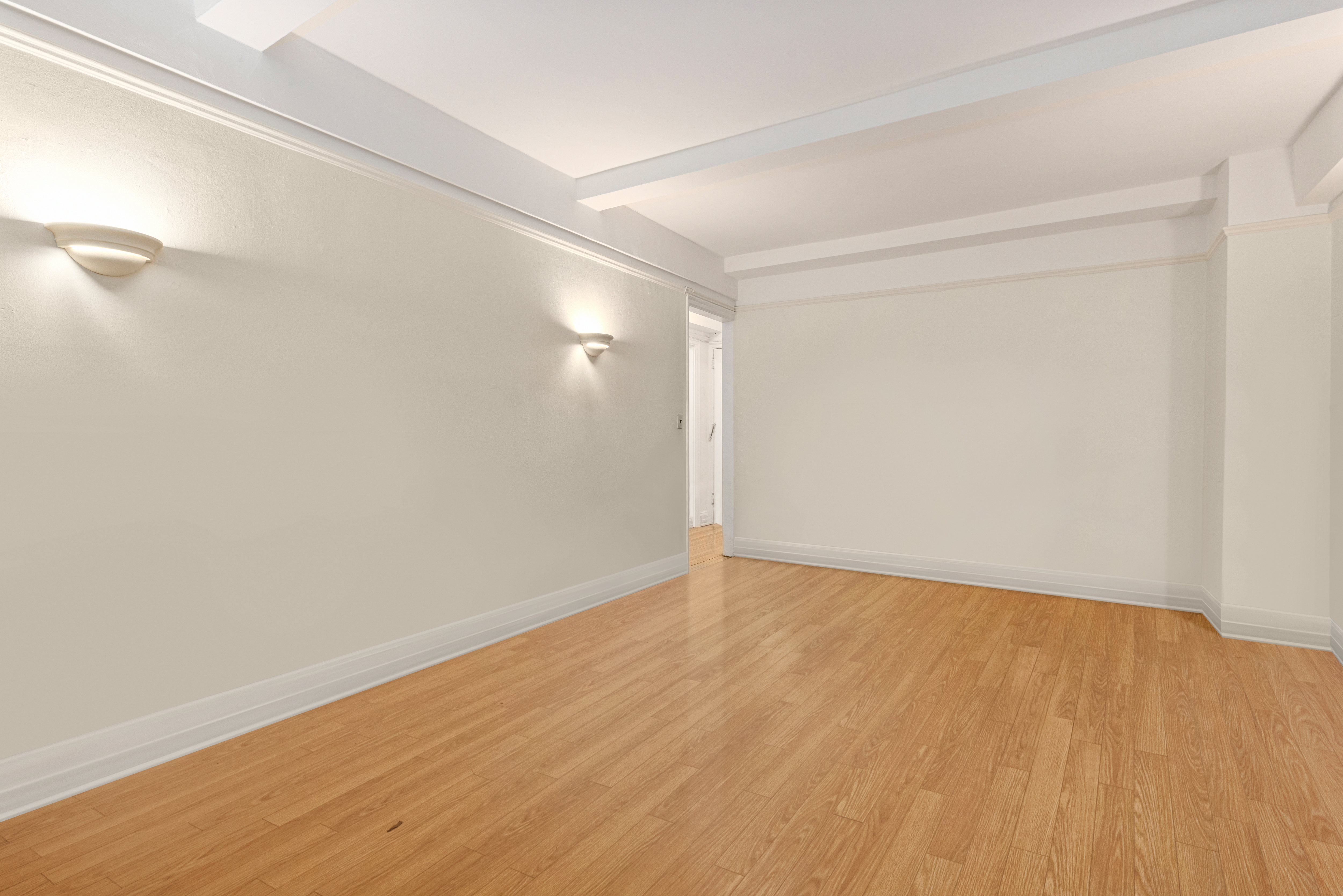 235 West 102nd Street, Unit 5V Manhattan, NY 10025 - Photo 4 of 15 a view of an empty room with wooden floor