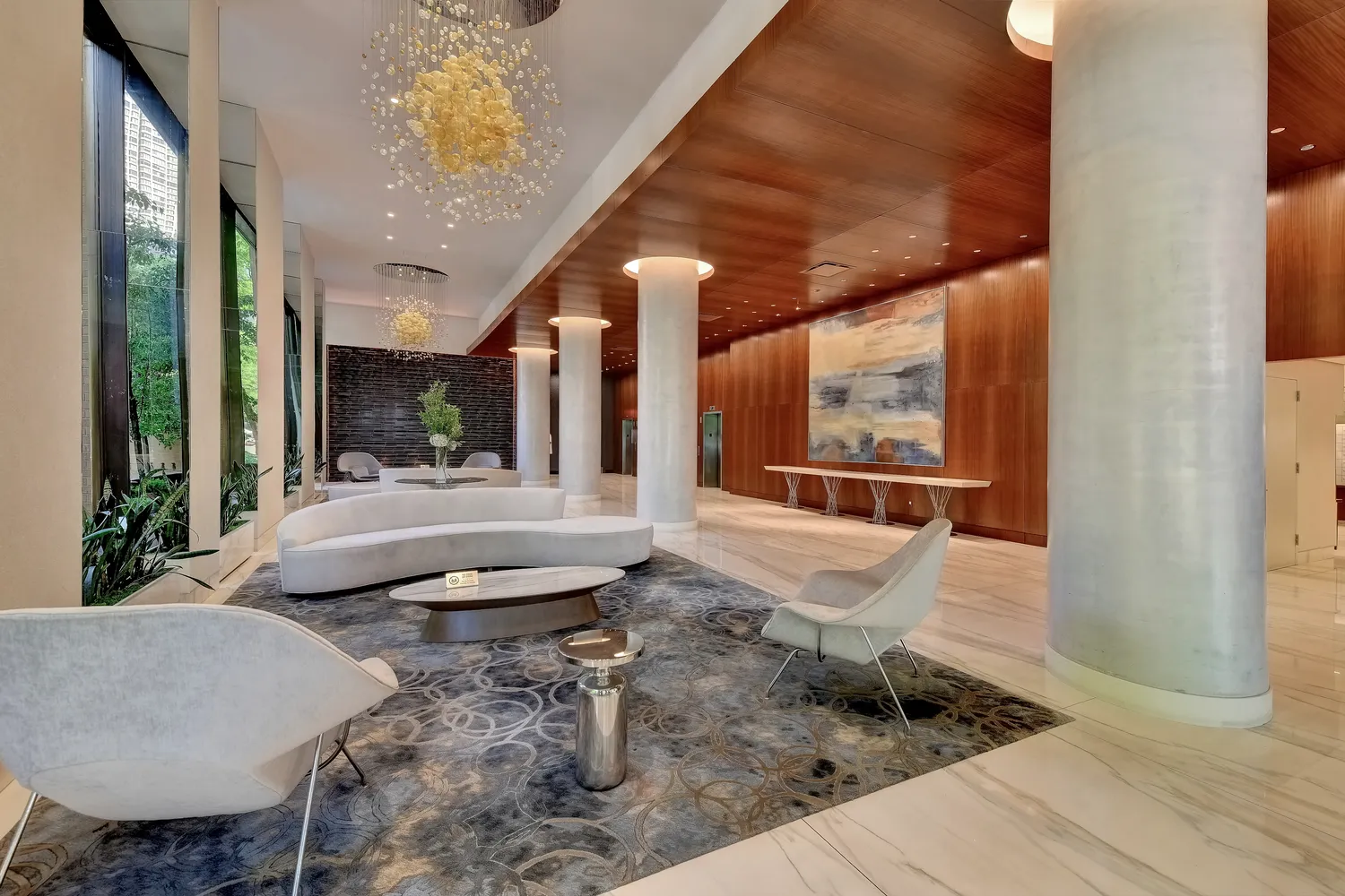 a lobby with furniture and flat screen tv