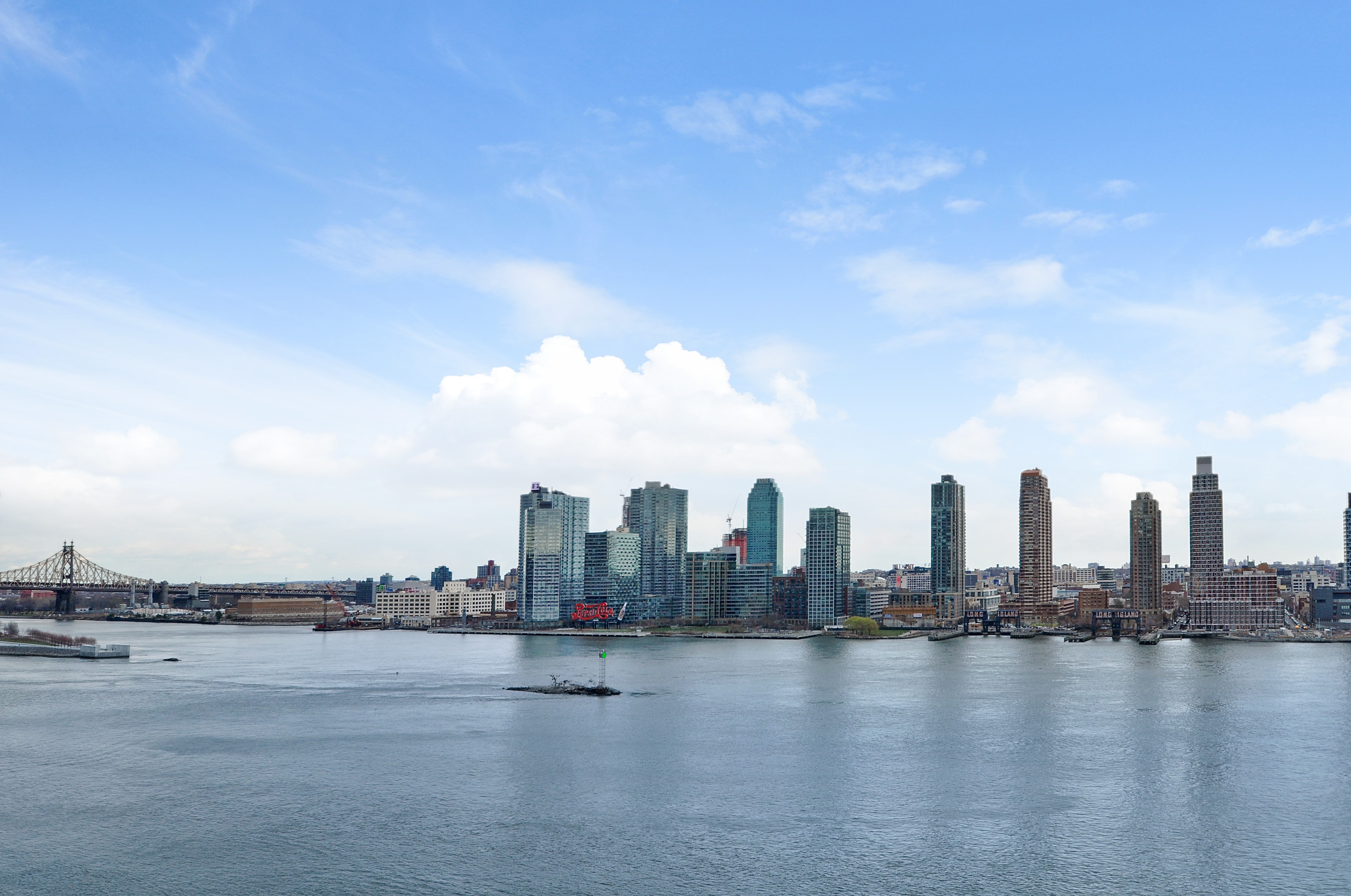 a view of a city with tall buildings