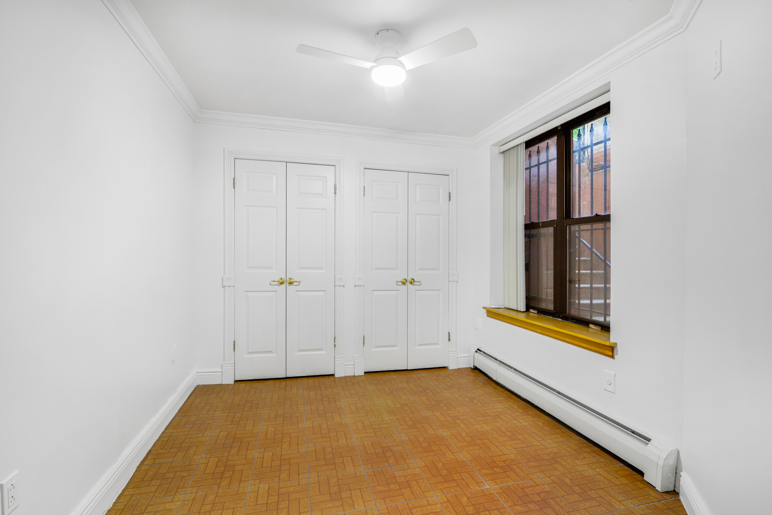 3 East 128th Street, Unit GARDEN Manhattan, NY 10035 - Photo 6 of 10 an empty room with window