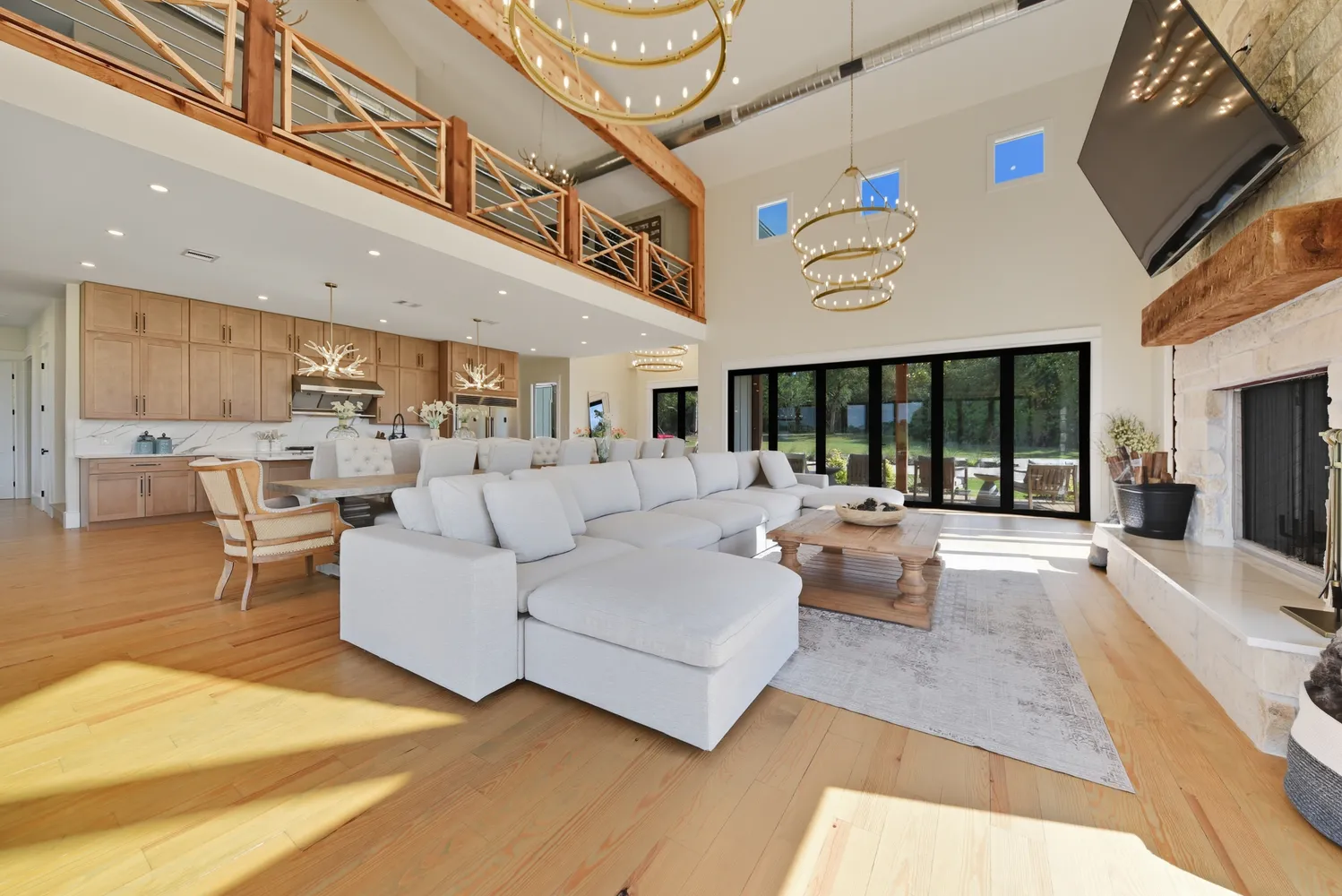 a living room with furniture and large windows