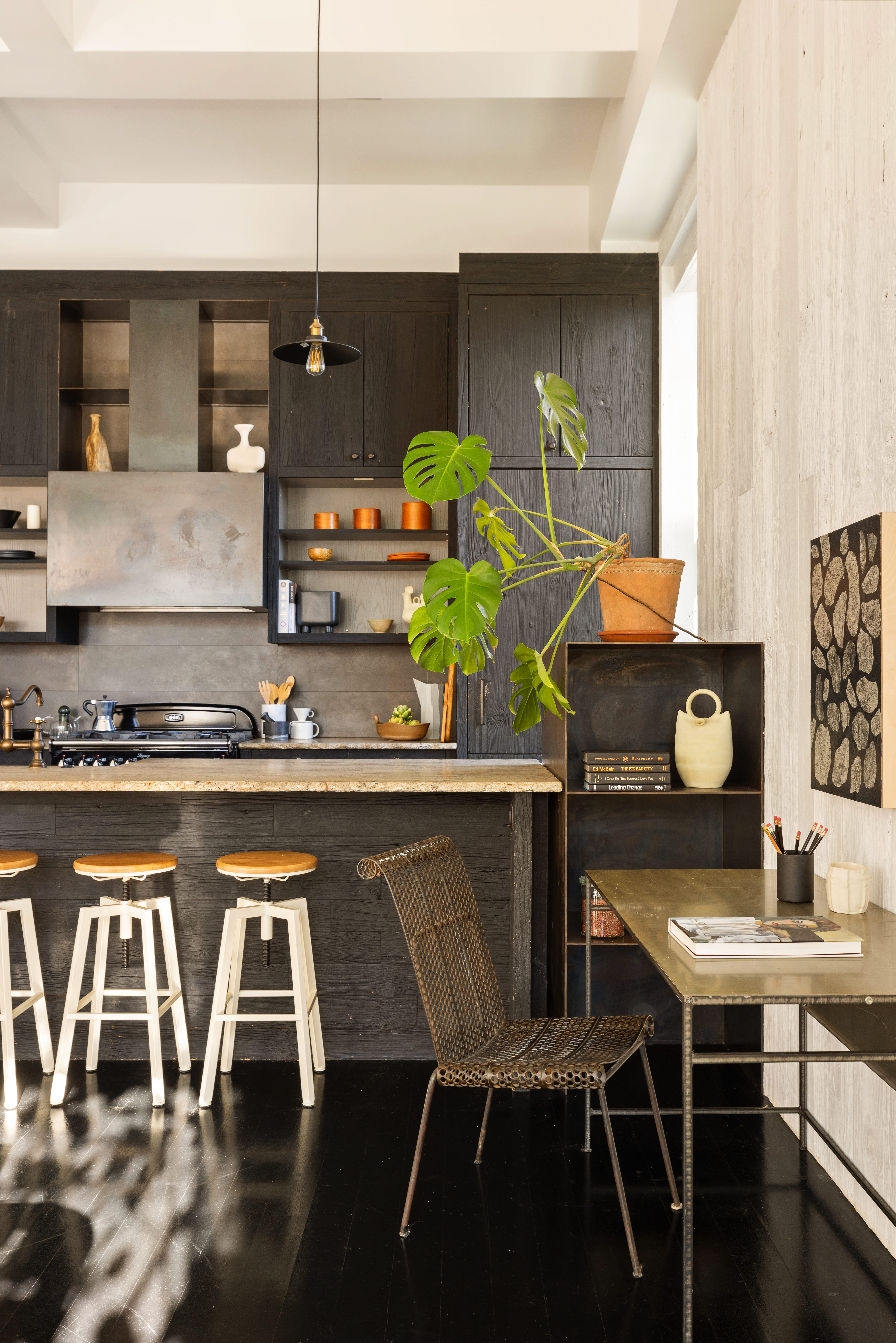 7 Bond Street, Unit PHAB Manhattan, NY 10012 - Photo 4 of 20 a kitchen with a table chairs and a stove