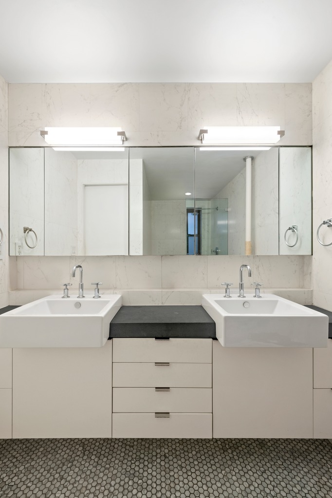 290 6th Avenue, Unit 2KL Manhattan, NY 10014 - Photo 11 of 18 a bathroom with a sink vanity and mirror
