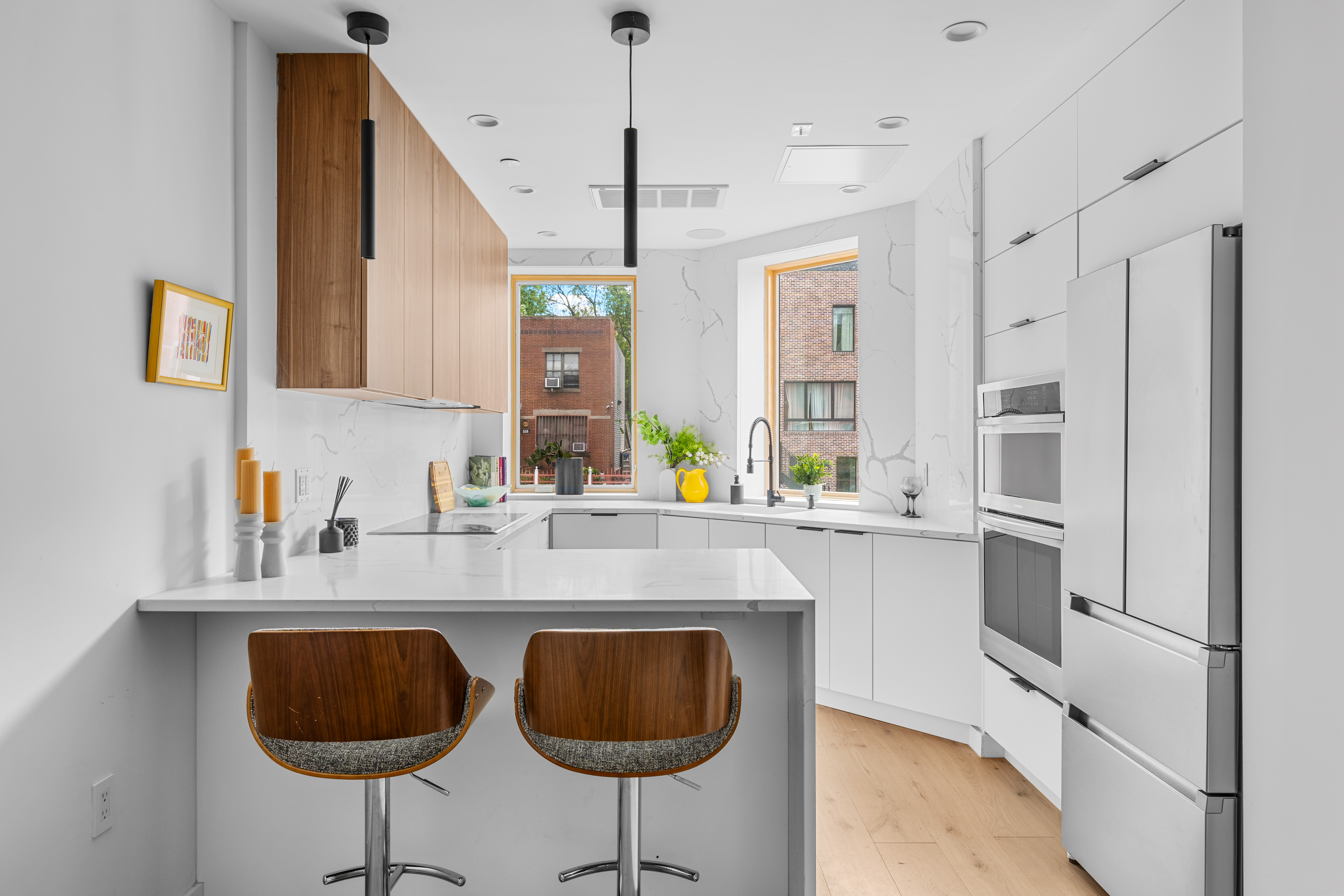 545 Lexington Avenue, Unit 1 Brooklyn, NY 11221 - Photo 2 of 19 a kitchen with stainless steel appliances granite countertop a sink and a refrigerator