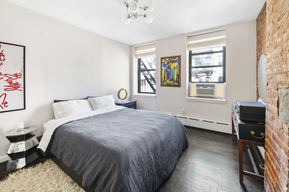 72 East 3rd Street, Unit 5A Manhattan, NY 10003 - Photo 6 of 16 a bedroom with a bed and a window