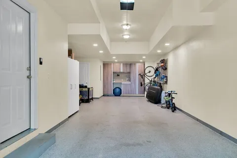 an empty room with closet and windows
