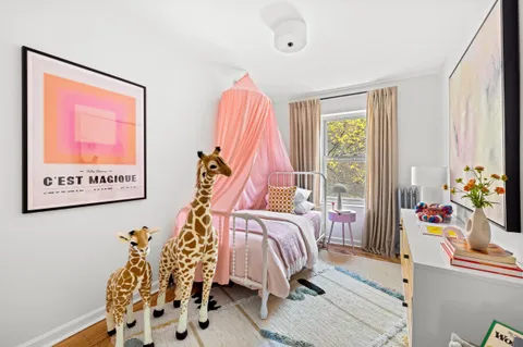 a bed room with a bed and a window