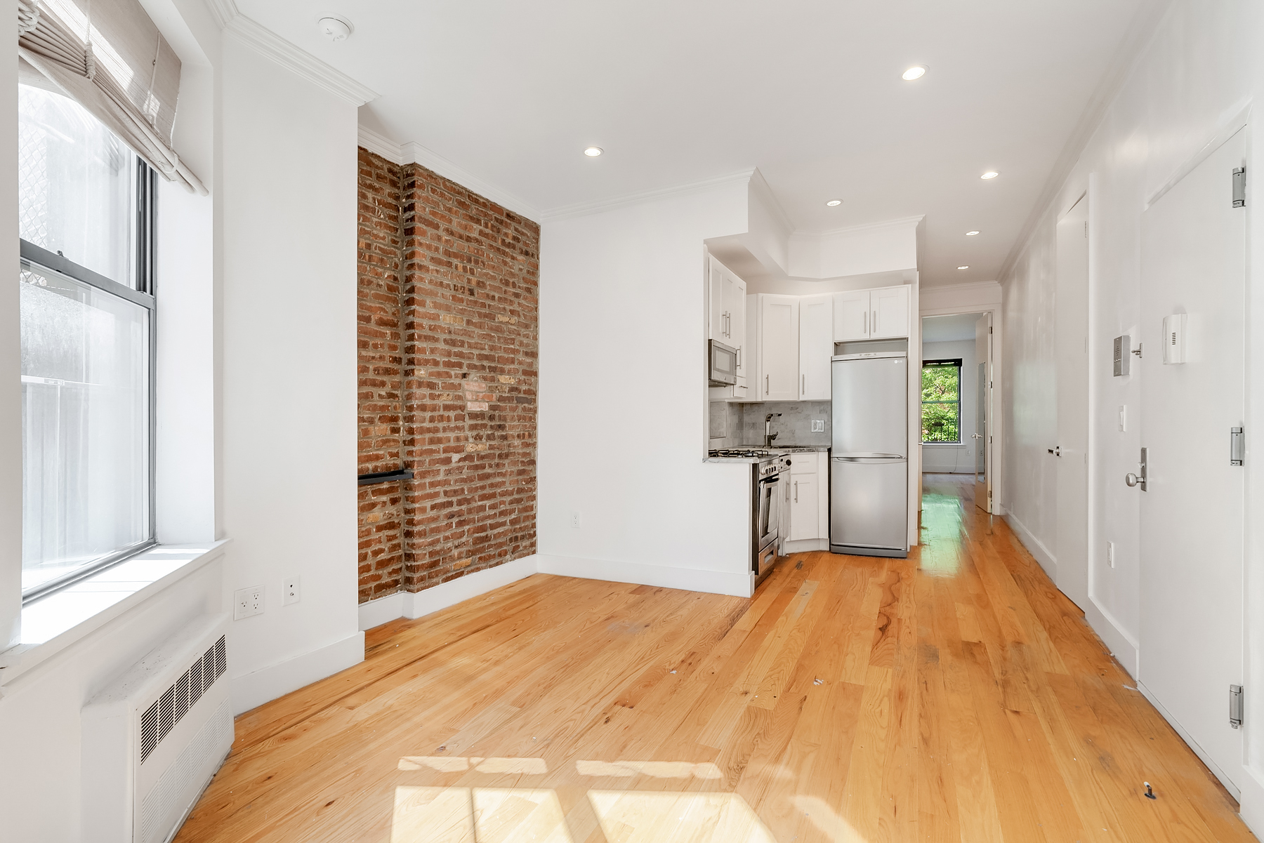 a view of kitchen with wooden floor