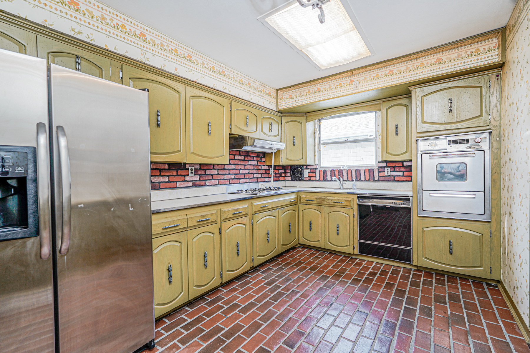 461 Mayfair Drive South Brooklyn, NY 11234 - Photo 8 of 30 a kitchen with stainless steel appliances a refrigerator sink and stove