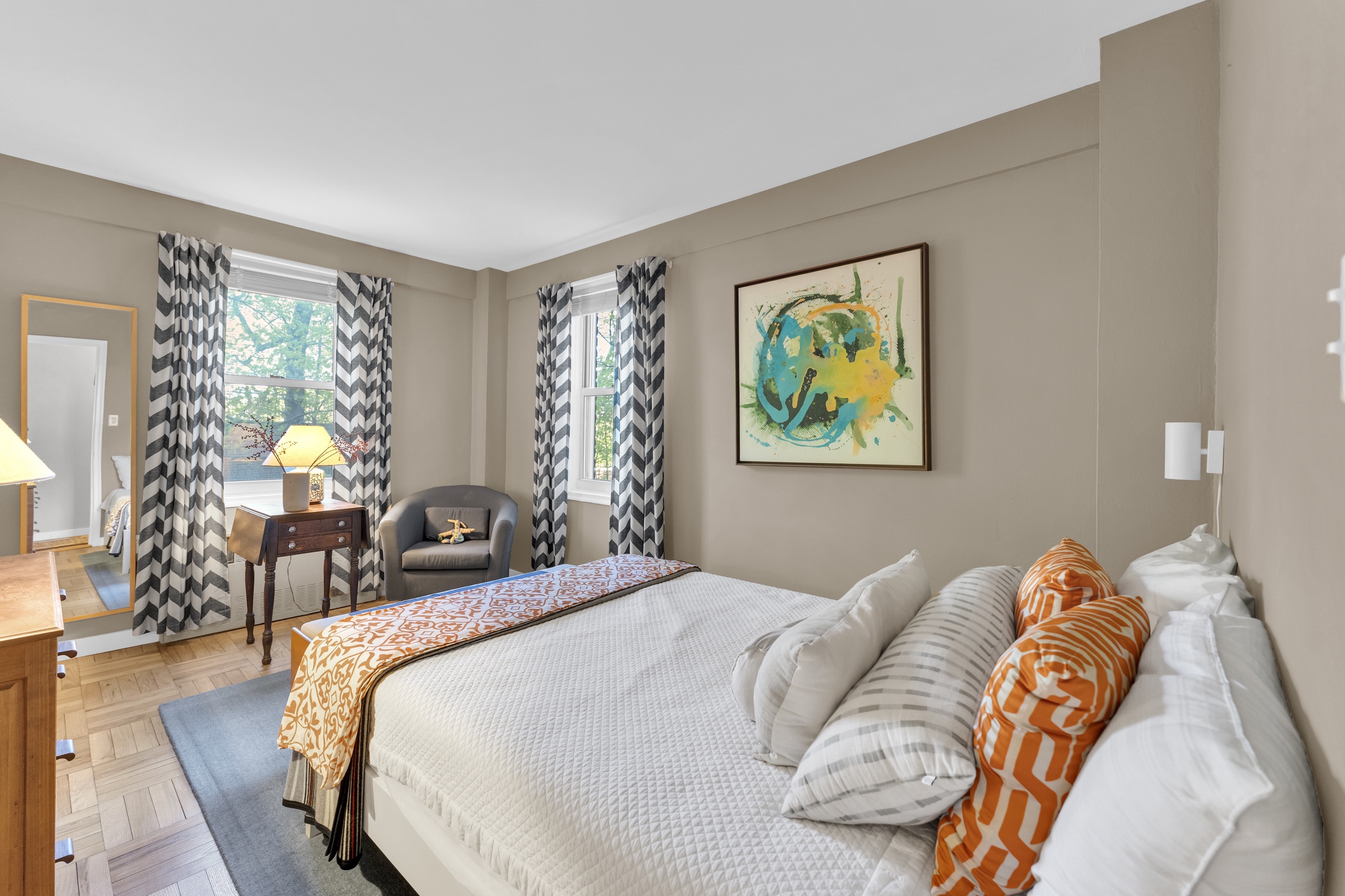 4555 Henry Hudson Parkway West, Unit A310 Bronx, NY 10471 - Photo 11 of 16 a bed sitting in a bedroom next to a window