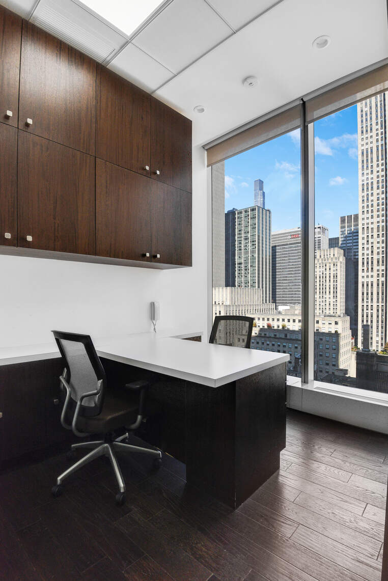 50 West 47th Street, Unit Undisclosed Manhattan, NY 10036 - Photo 14 of 27 a room with a large window and furniture