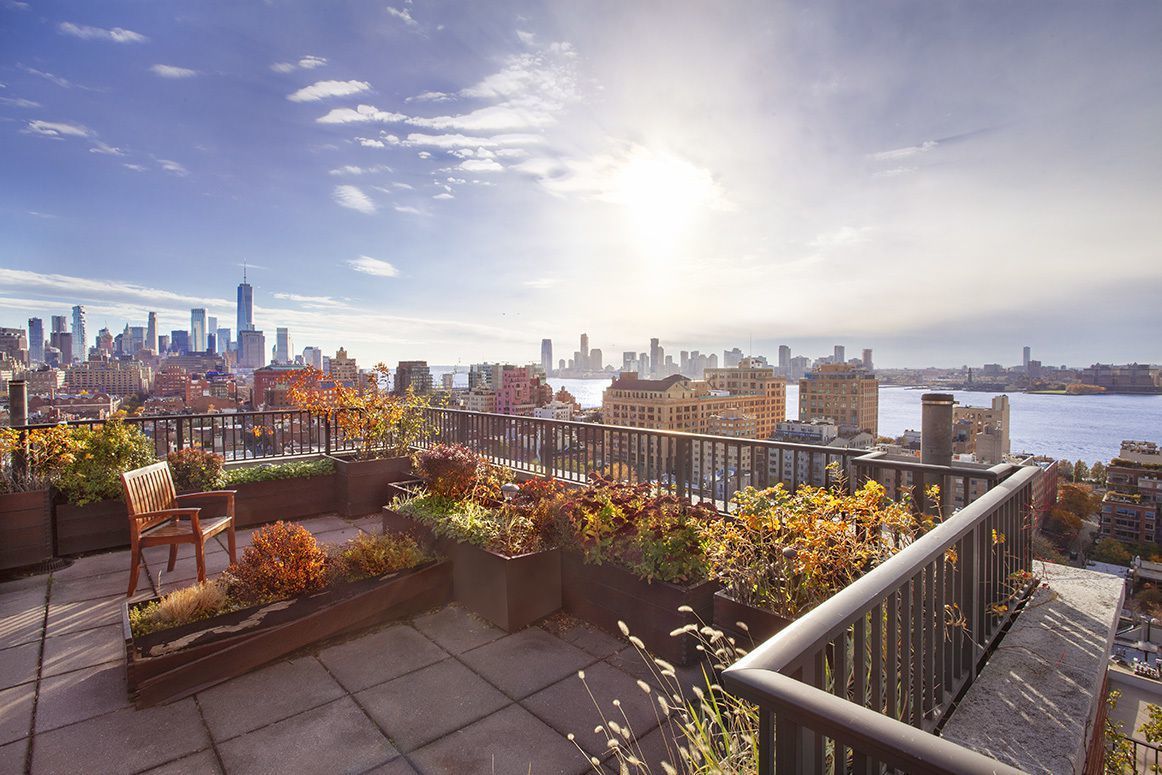 61 Jane Street, Unit 5A Manhattan, NY 10014 - Photo 10 of 13 a city view from a balcony with seating space
