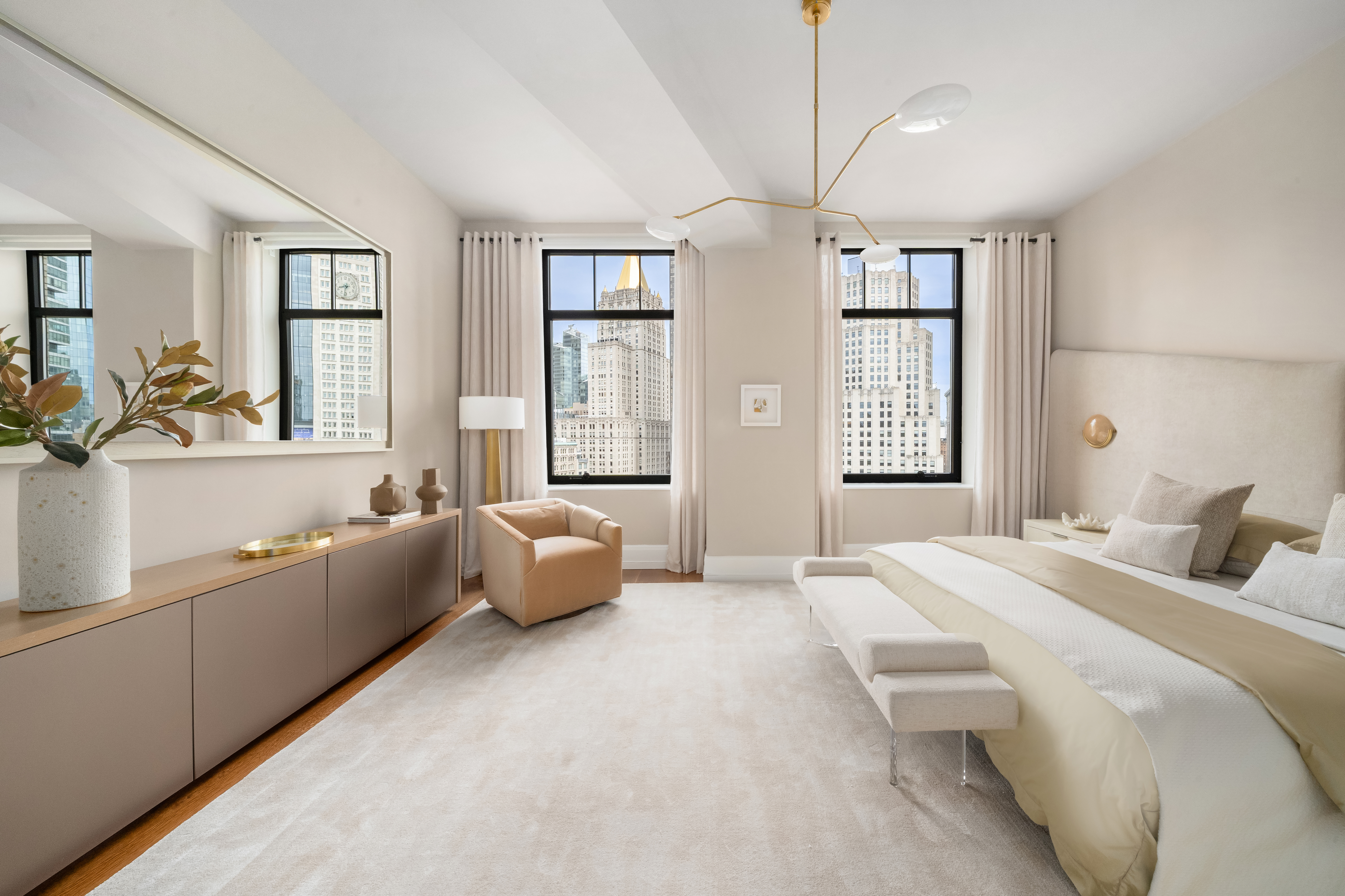 10 Madison Square West, Unit 12D Manhattan, NY 10010 - Photo 11 of 21 a spacious bedroom with a bed couch and windows