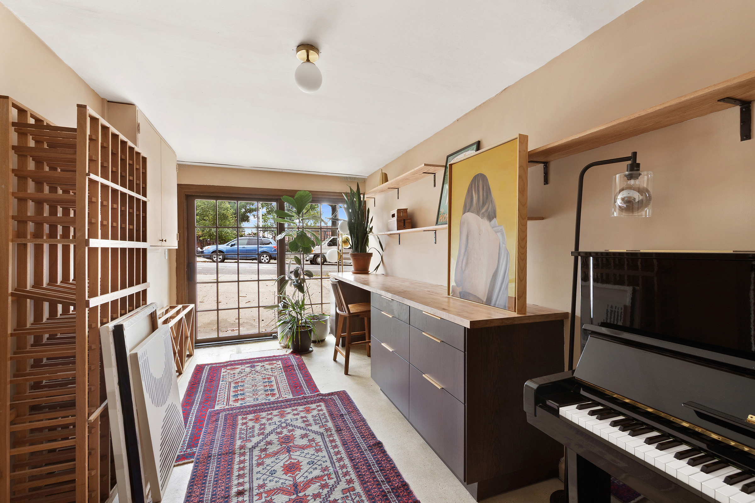 209 Onderdonk Avenue Queens, NY 11385 - Photo 10 of 16 a living room with furniture and a flat screen tv