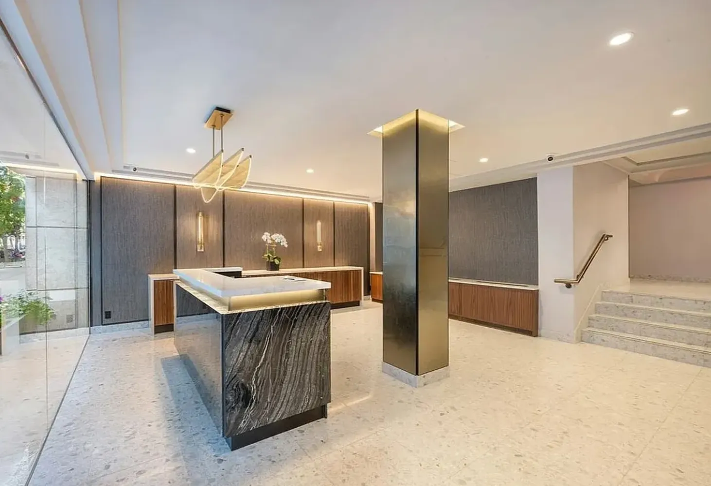 a kitchen with stainless steel appliances kitchen island a sink stove and refrigerator