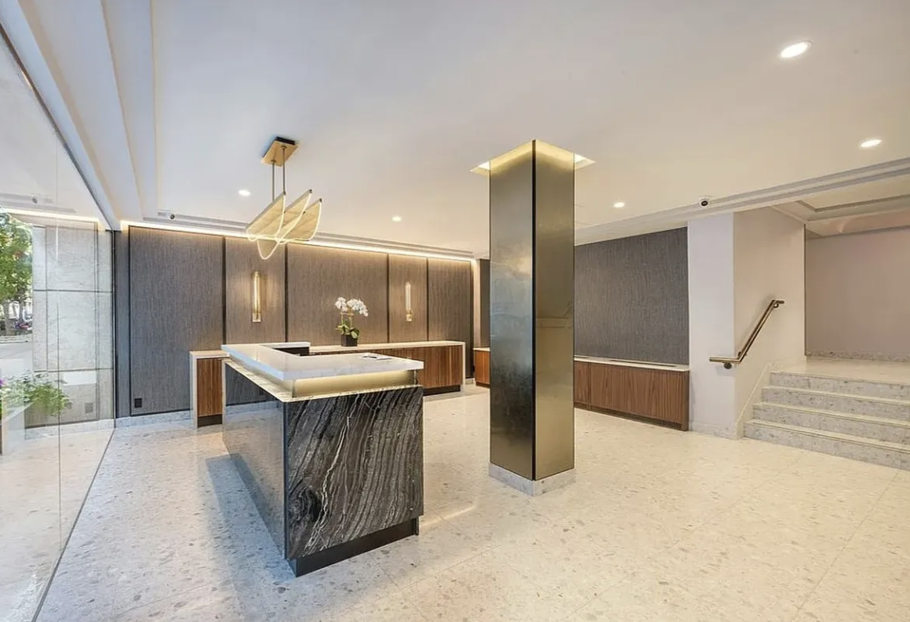 445 East 86th Street, Unit 12A Manhattan, NY 10028 - Photo 8 of 11 a kitchen with stainless steel appliances kitchen island a sink stove and refrigerator