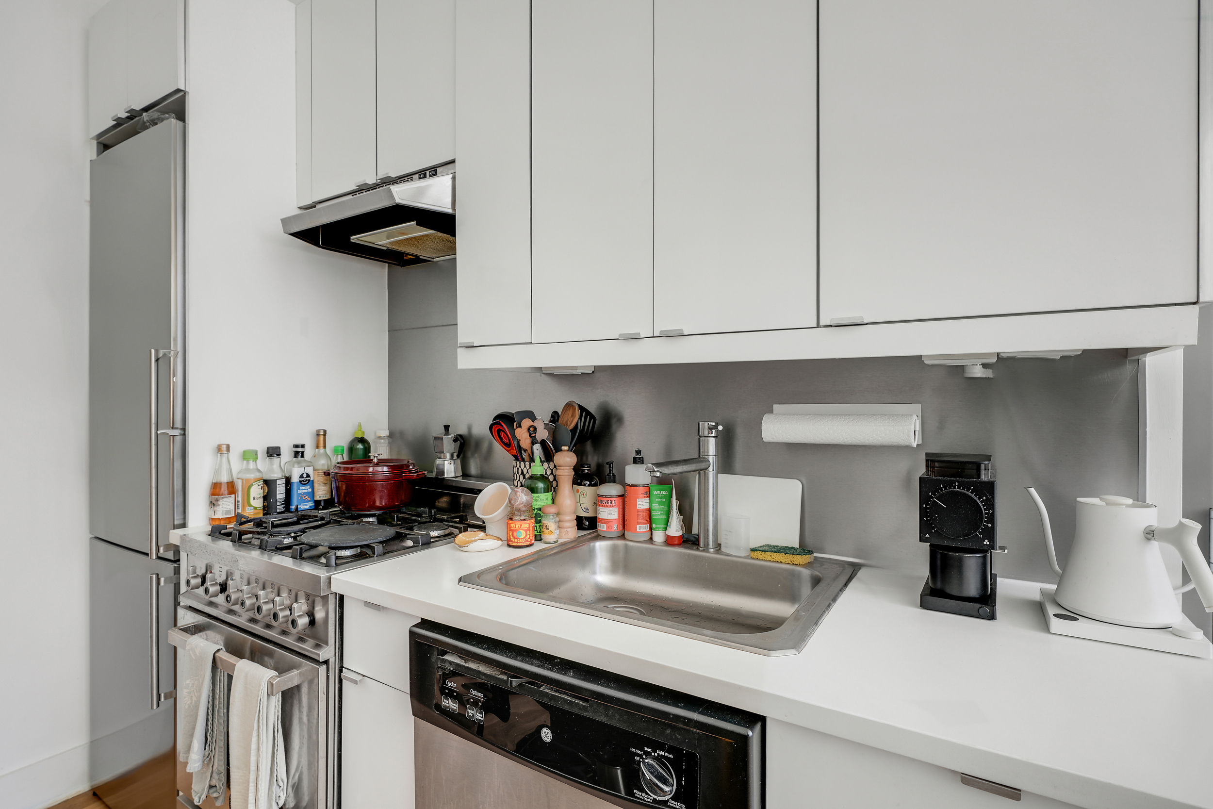622 Grand Avenue, Unit 102 Brooklyn, NY 11238 - Photo 9 of 13 a kitchen with appliances cabinets and a counter top space
