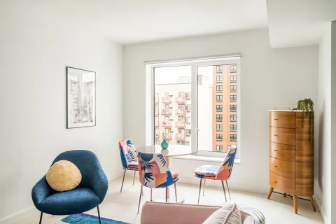 a dining room with furniture and window