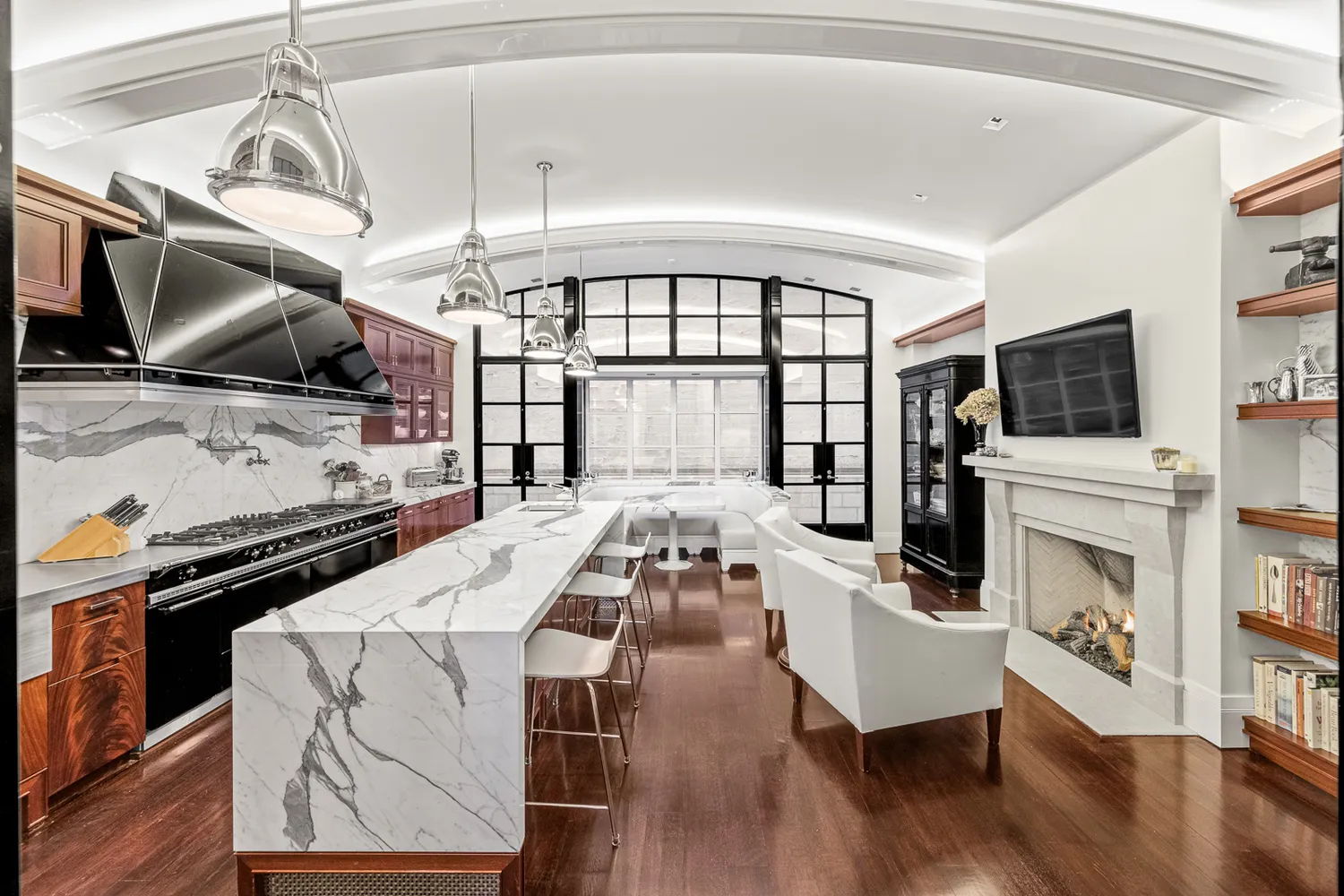 a living room with fireplace furniture and a flat screen tv