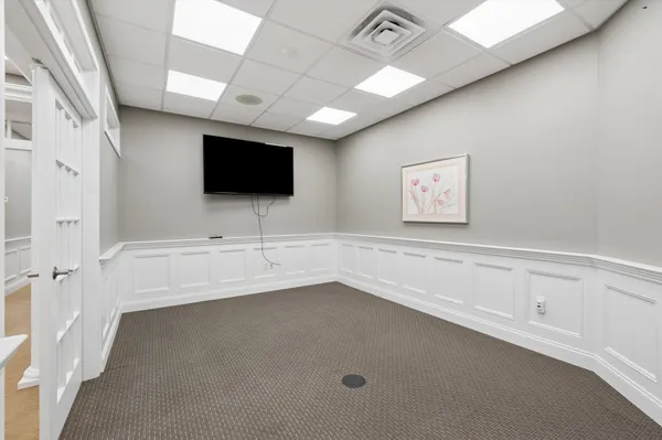 a spacious bathroom with a bathtub and a sink