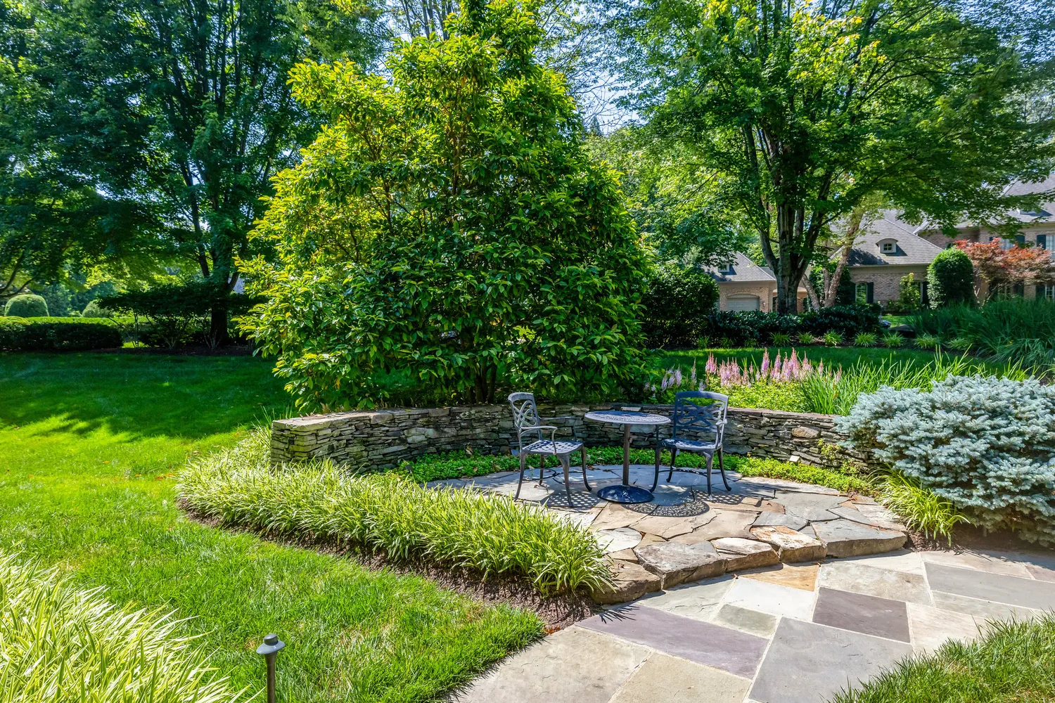 a view of a hallway with wooden floor windows and a living room