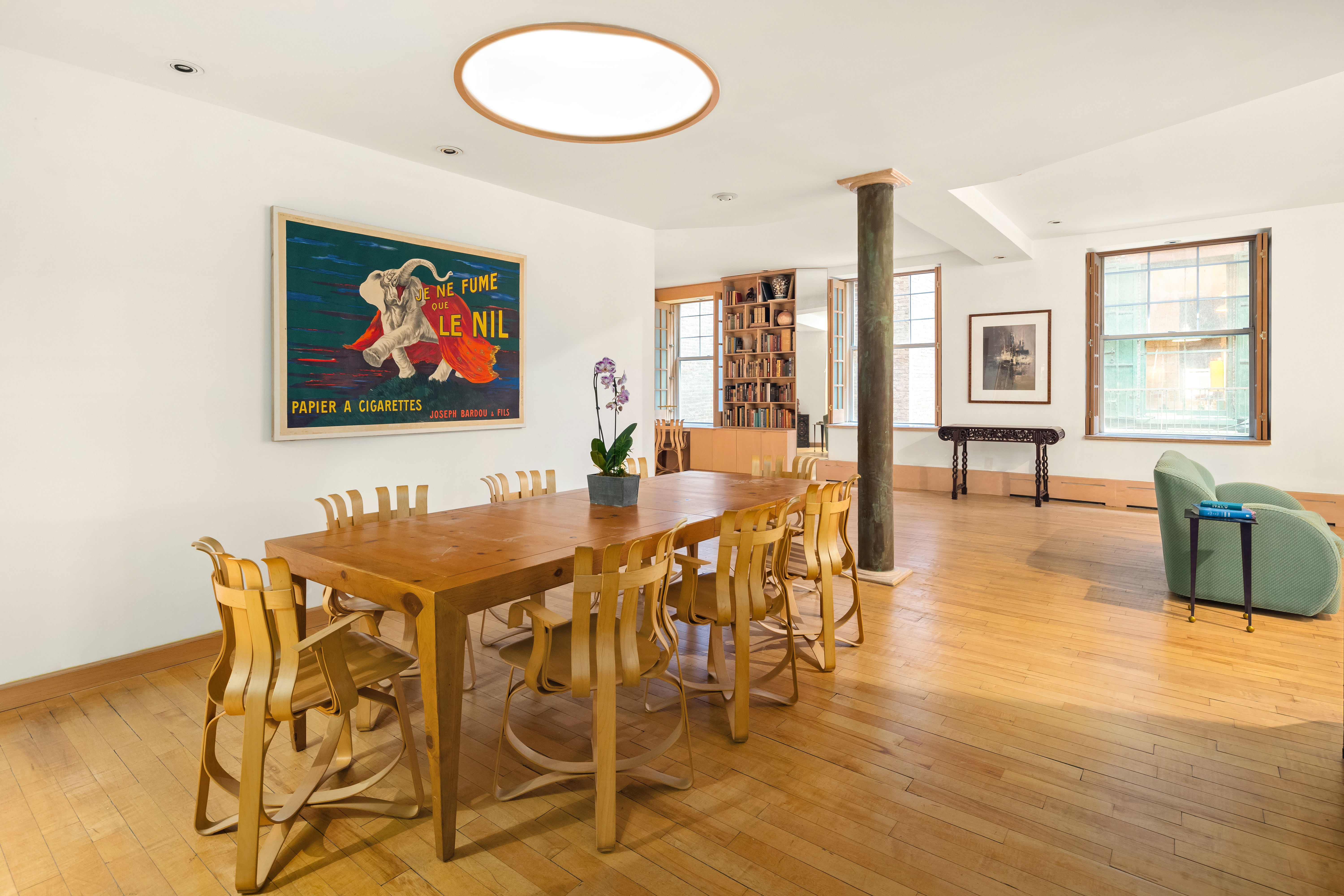 131 Mercer Street, Unit 2B Manhattan, NY 10012 - Photo 5 of 18 a view of a dining room with furniture and wooden floor