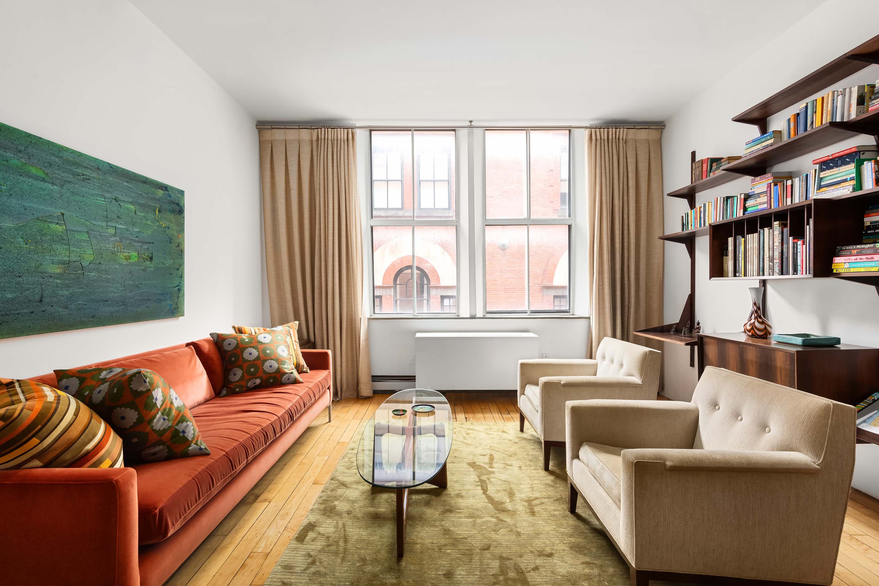 57 Laight Street, Unit 3 Manhattan, NY 10013 - Photo 4 of 15 a living room with furniture or couch and a large window