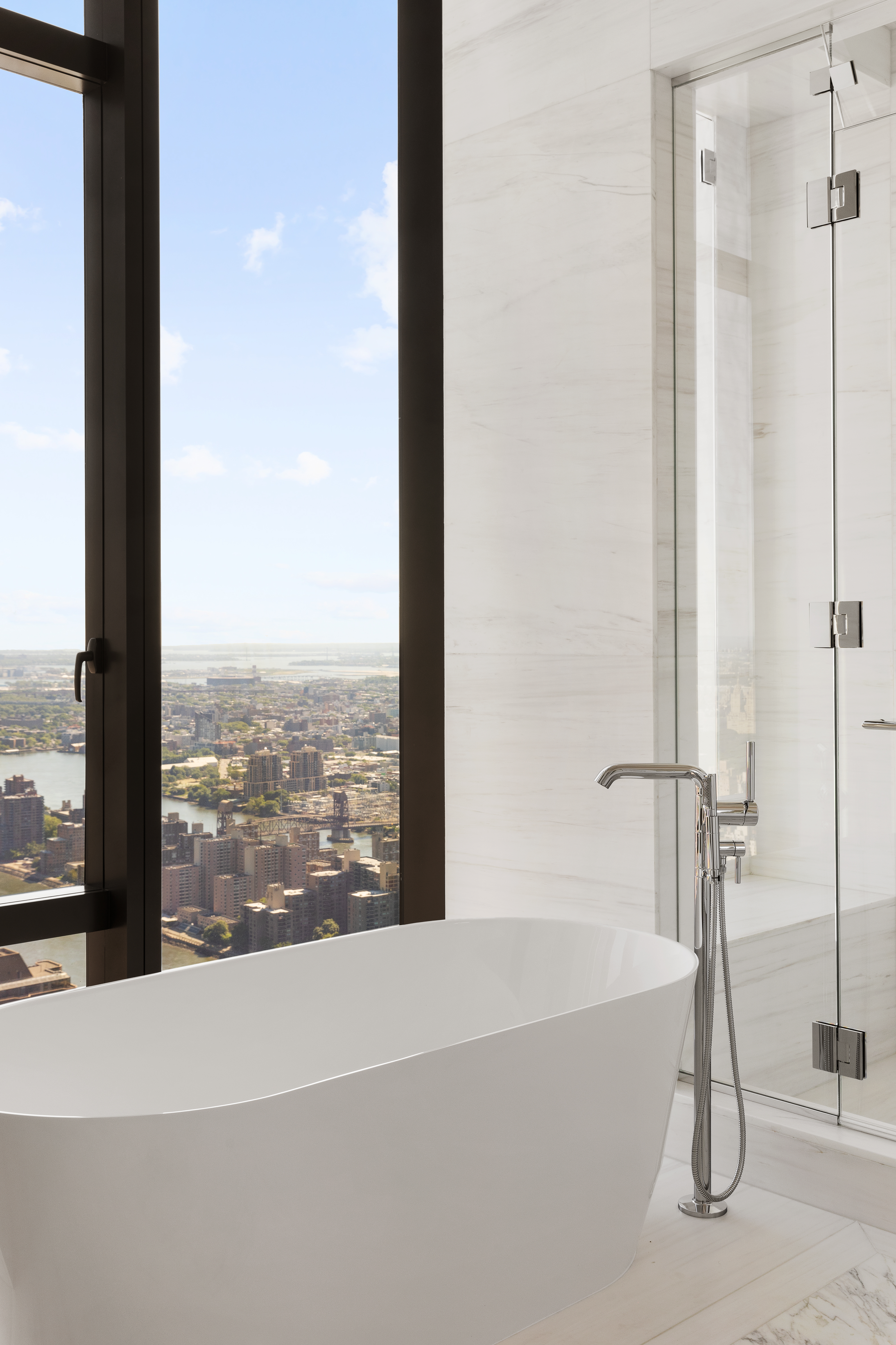 430 East 58th Street, Unit PH71 Manhattan, NY 10022 - Photo 10 of 26 a bathroom with a bathtub and shower